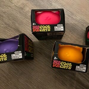 4 Nee Doh Cool Cats - Vibrant Pink, Purple, and Orange Plush Toys
